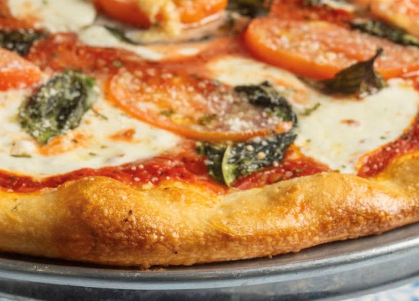 Margherita pizza with mozzarella and basil, Sal’s NY Slice Pizzeria